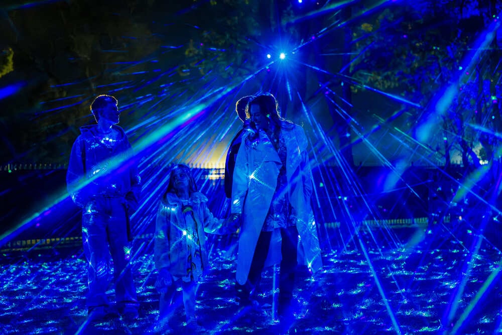 Indigo light arches over the garden path